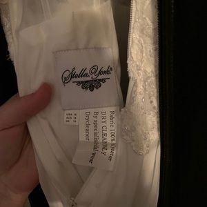 Brand new wedding dress. Never left the bag, Spaghetti strap with slit.